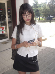 Plaid cross-button collar top